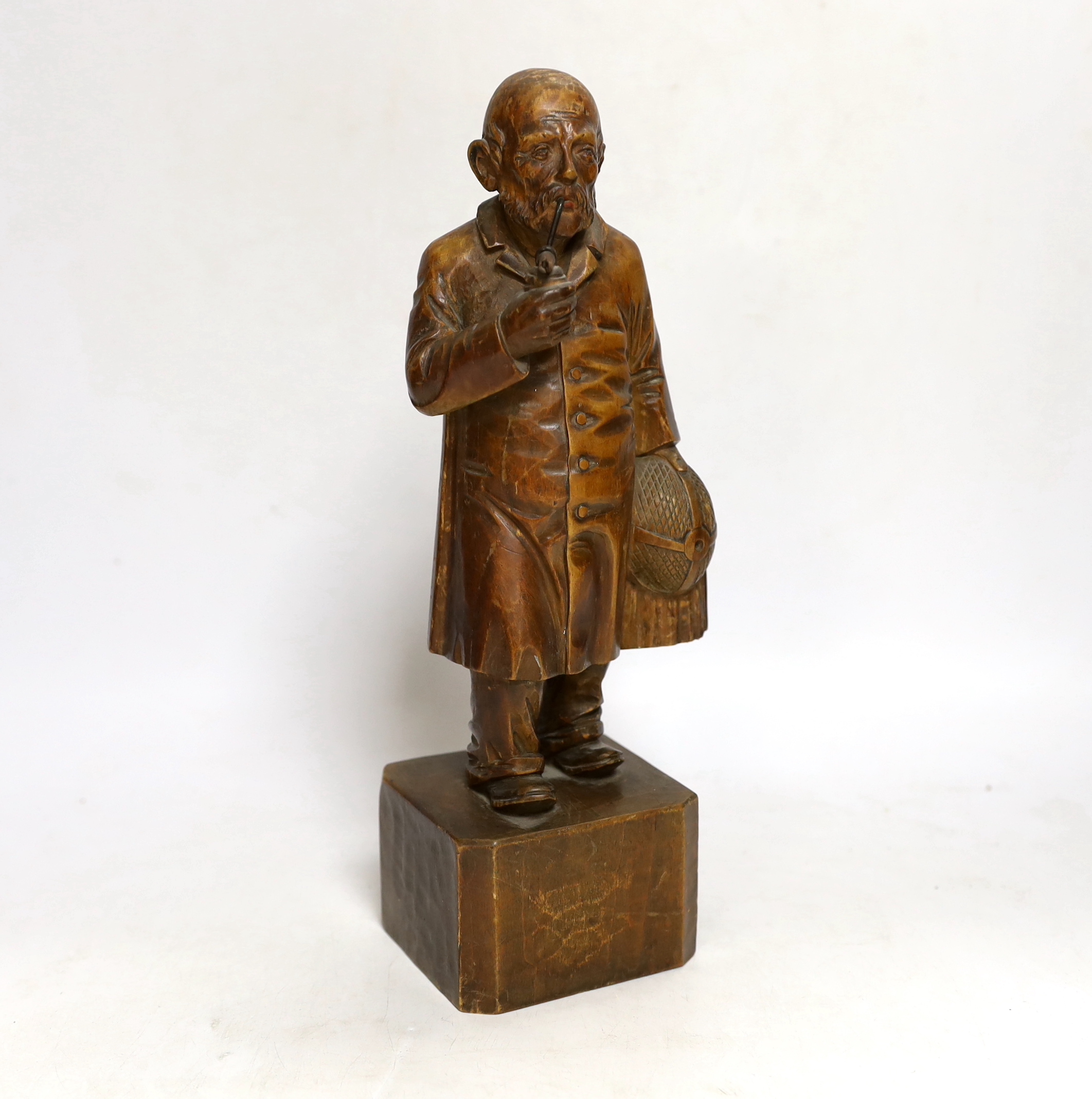 A German carved wood figure of a man, 28cm